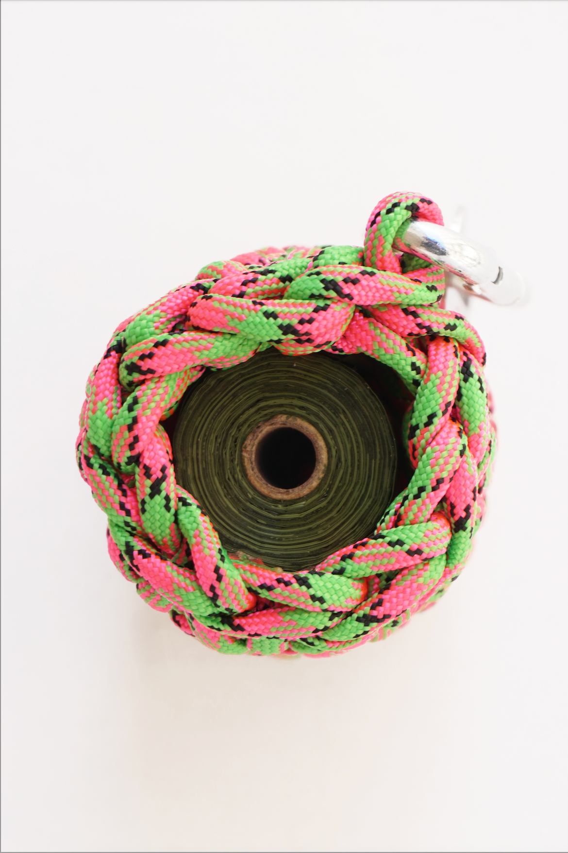 Green and pink pet bag holder made of paracord rope
